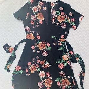 Ruffle bottom knee length floral black dress.